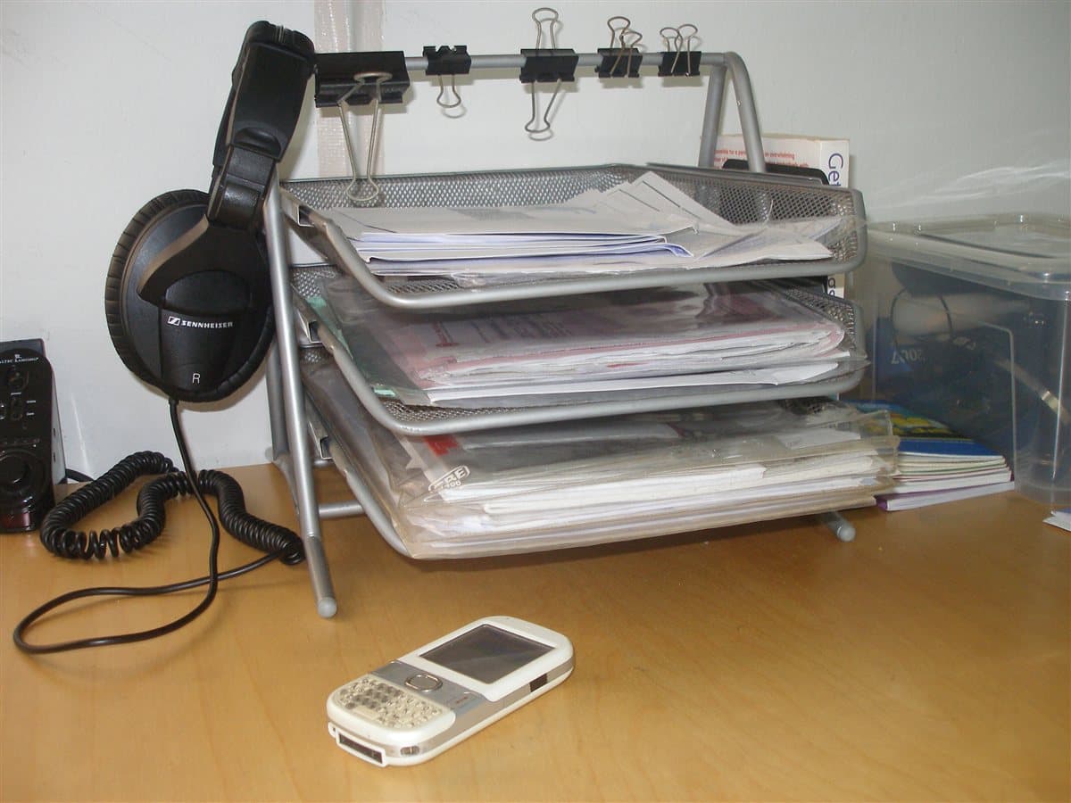 Document inbox trays representing batch pdf to text conversion queue and QA review stages