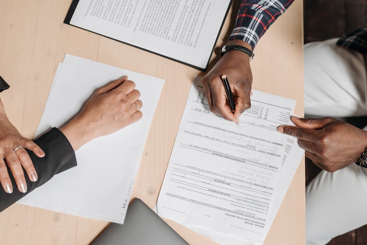 Teams signing and reviewing paperwork in a PDF page to PNG conversion workflow