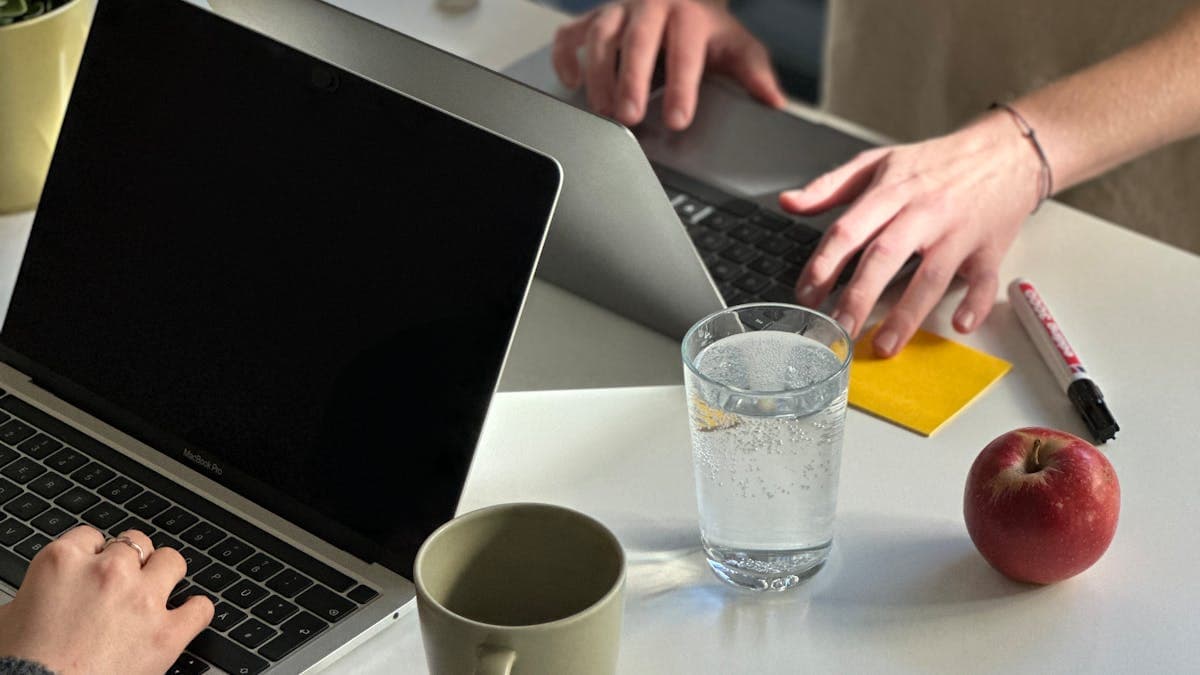 Team reviewing converted PDF slides and notes during a PowerPoint editing pass
