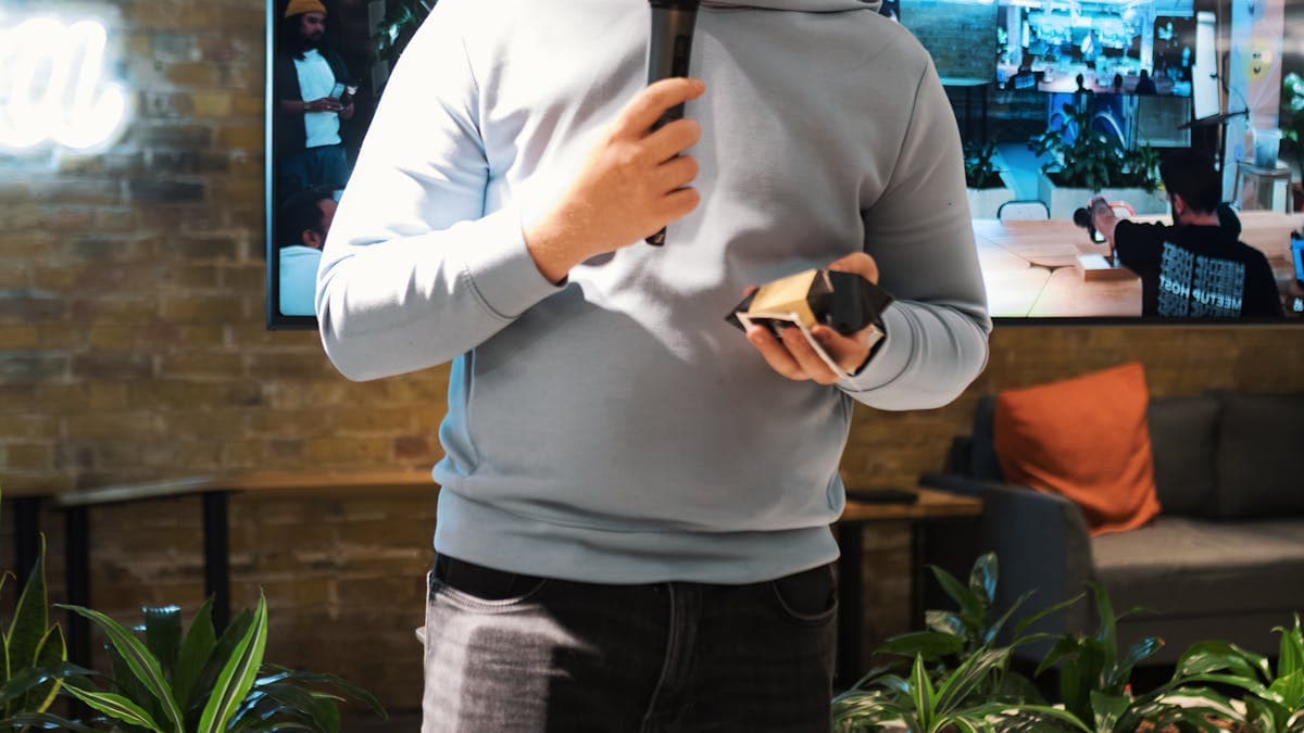 Presenter and large screen used in a PDF to PowerPoint workflow review session