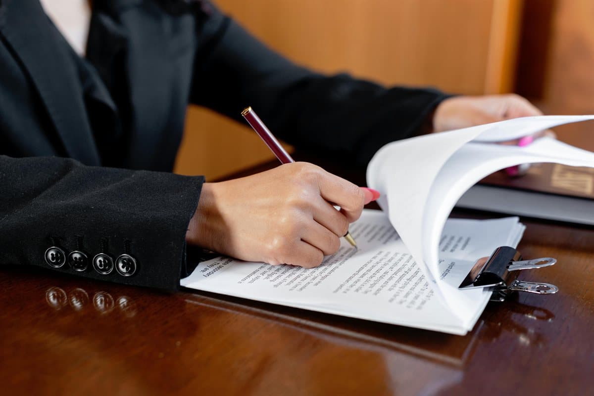 Reviewer checking clause readability after applying how to watermark a PDF settings to legal pages